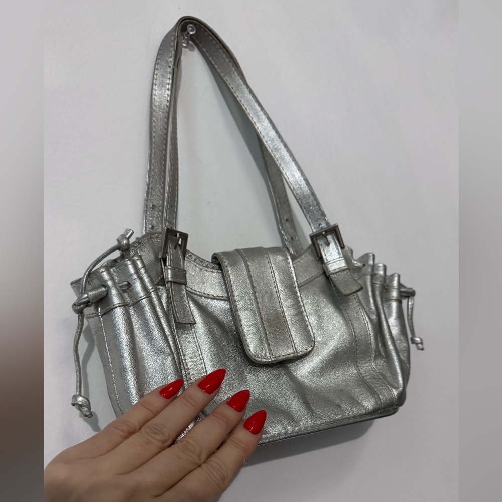 Hand hand purse. Fits any phone plus some extra. Silver. Real leather.